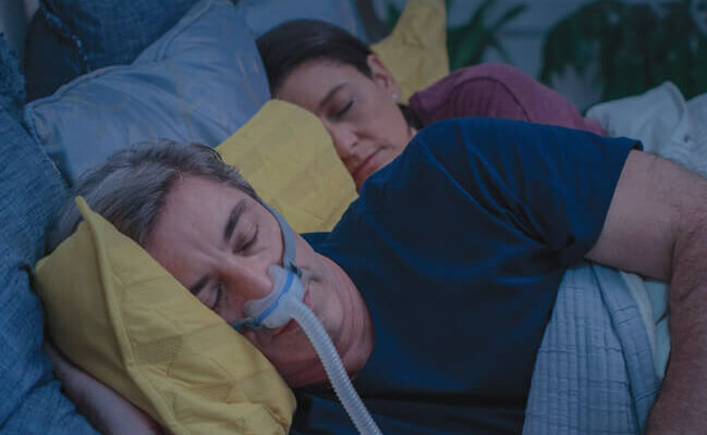 man-sleeping-with-under-the-nose-AirFit-N30-CPAP-mask-resmed-mobile